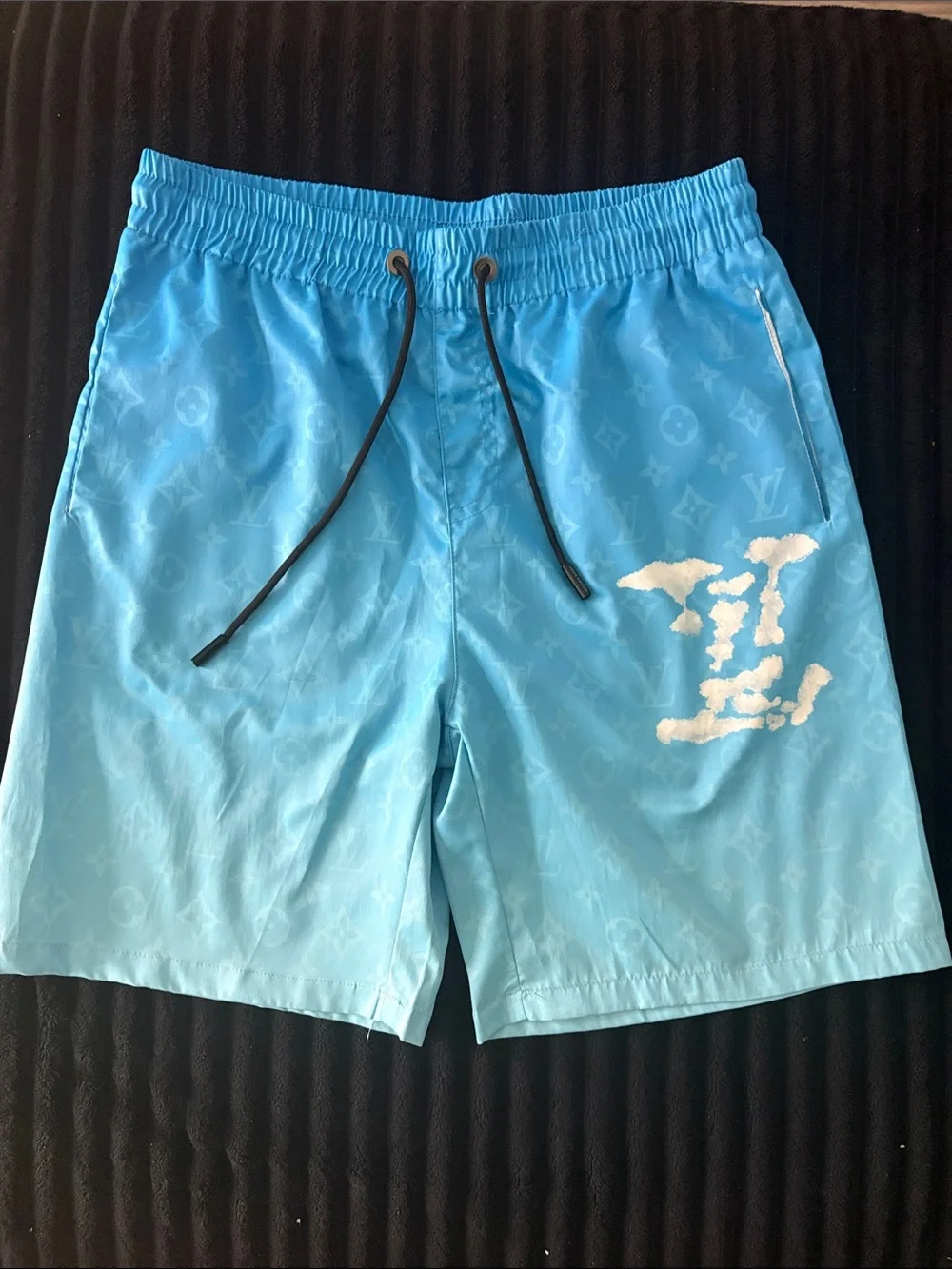 Louis Vuitton Men’s Sky Blue Monogram Swim Trunks with White Graphic